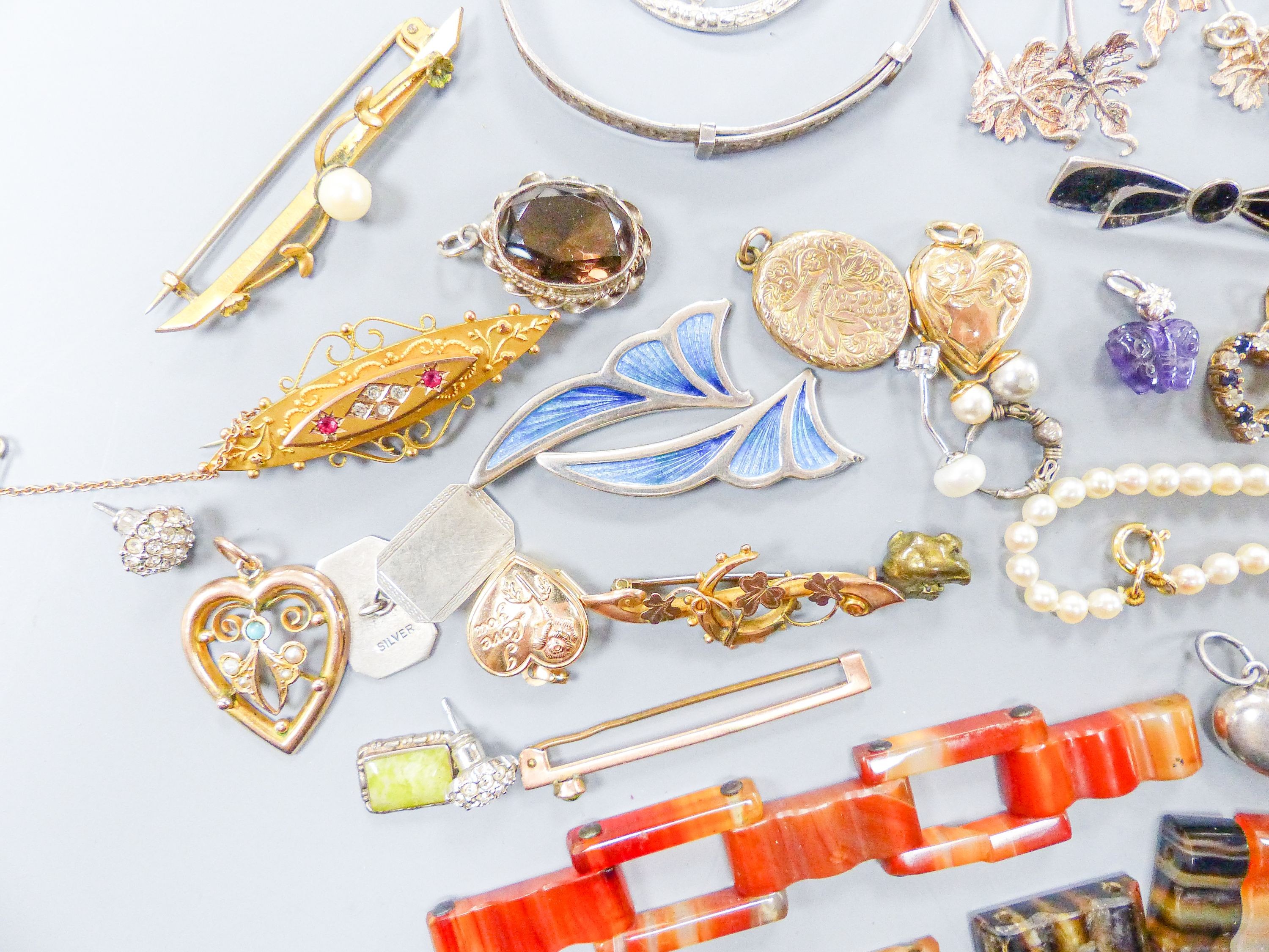 Assorted gold and silver jewellery including bar brooches, charm bracelet etc.